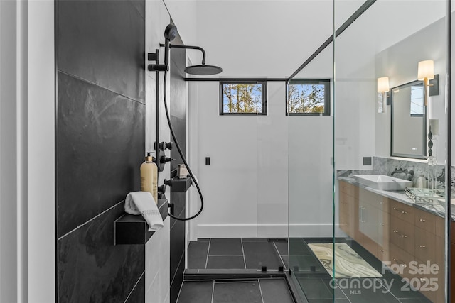 bathroom with vanity, tile patterned flooring, a shower, and plenty of natural light