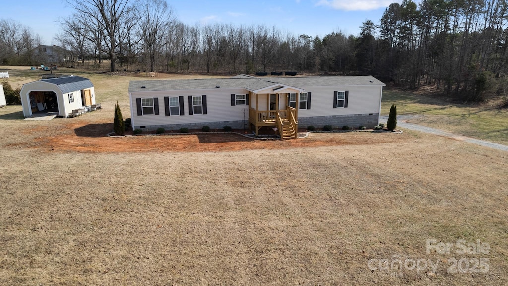 manufactured / mobile home featuring an outdoor structure