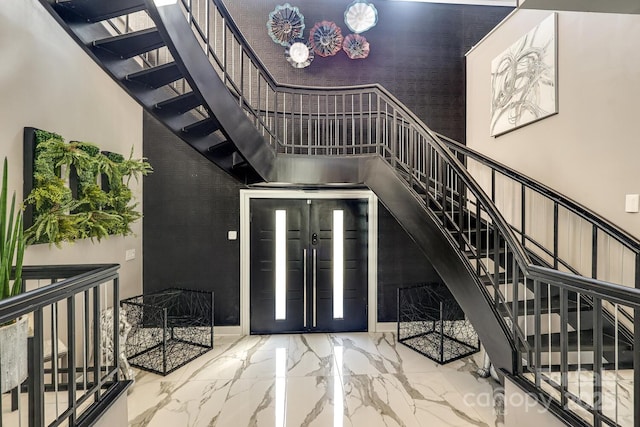 entrance foyer featuring a high ceiling