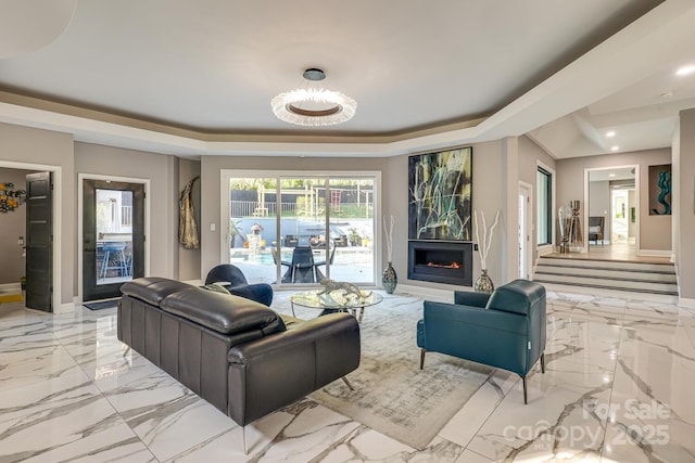 living room with a raised ceiling