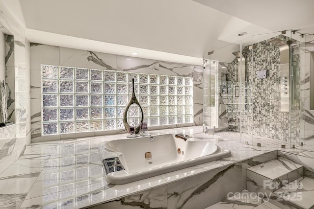 bathroom featuring tiled bath