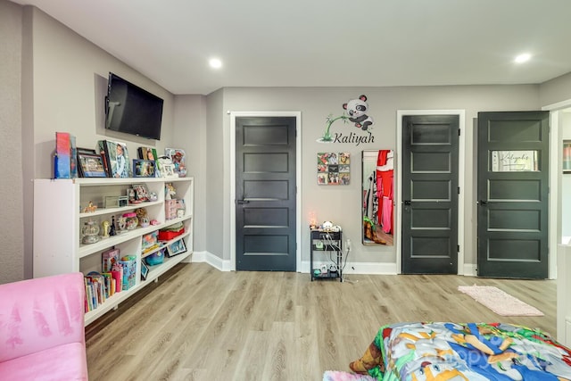 playroom with light wood-type flooring