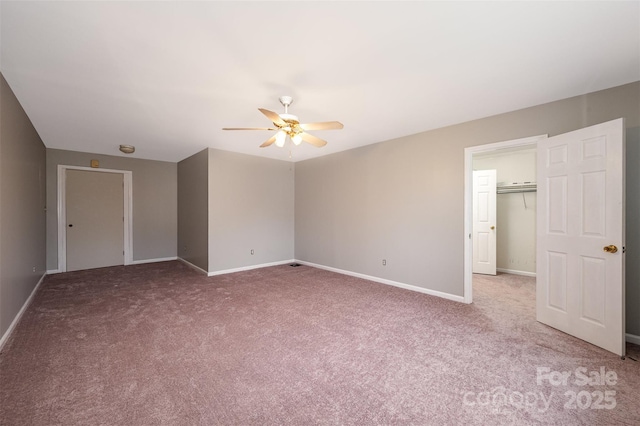 unfurnished bedroom featuring carpet floors, a closet, and ceiling fan