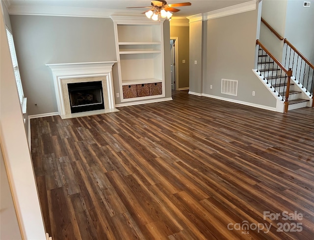 unfurnished living room with crown molding and dark wood-type flooring