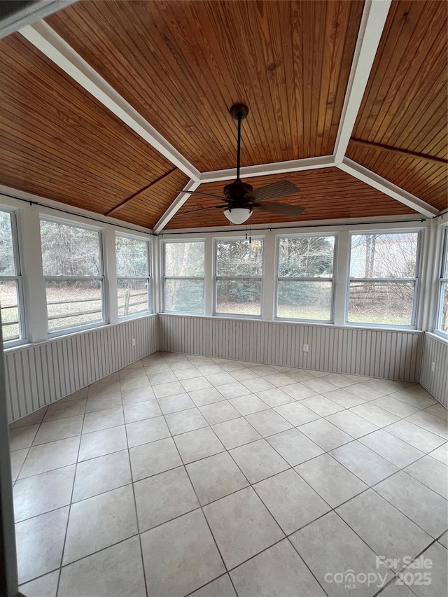 unfurnished sunroom with vaulted ceiling, ceiling fan, and wooden ceiling