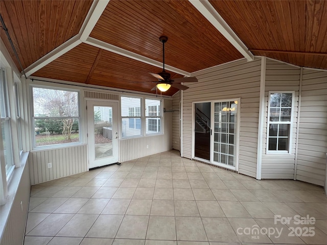 unfurnished sunroom featuring wood ceiling, ceiling fan, and lofted ceiling with beams