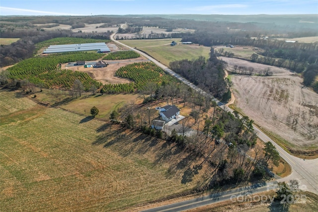 birds eye view of property featuring a rural view