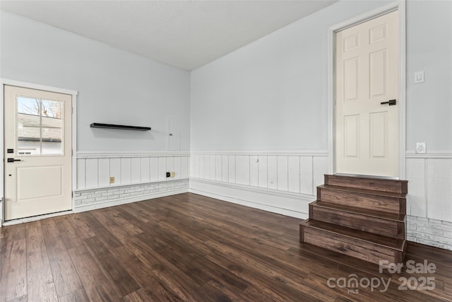 unfurnished living room with hardwood / wood-style floors