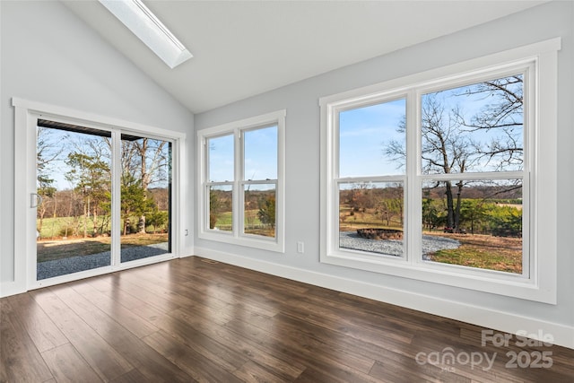 unfurnished sunroom featuring lofted ceiling with skylight