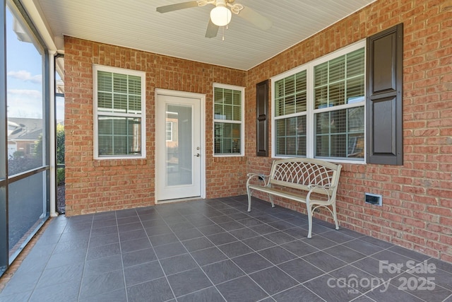 view of patio featuring ceiling fan