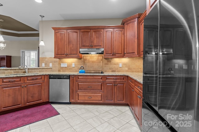 kitchen with sink, dishwasher, refrigerator, light stone counters, and decorative light fixtures