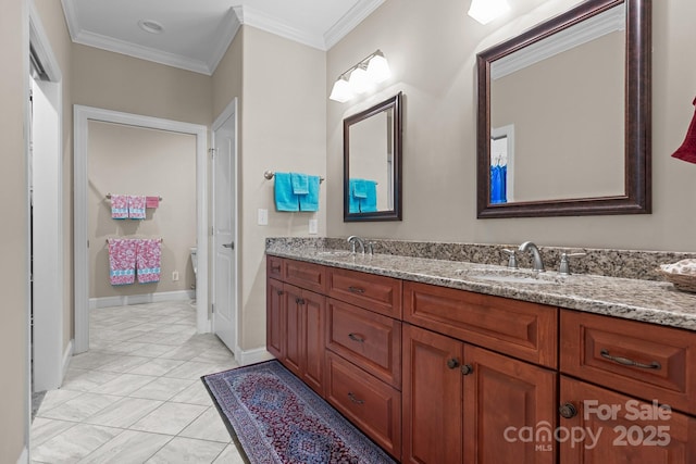 bathroom with tile patterned flooring, vanity, and crown molding