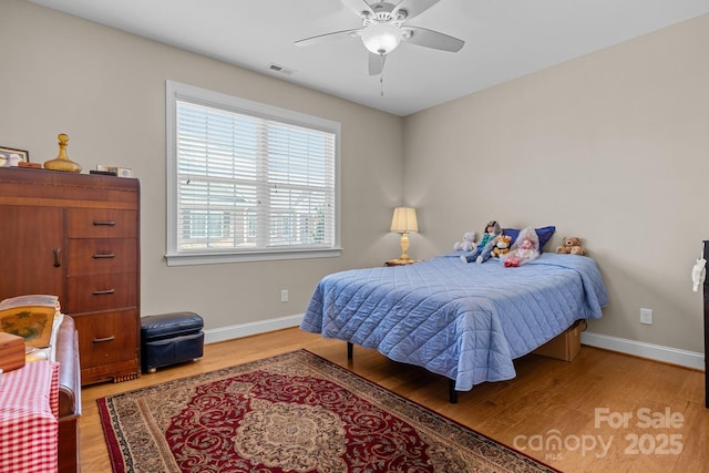 bedroom featuring hardwood / wood-style flooring and ceiling fan