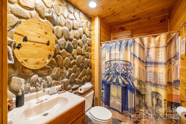 bathroom featuring vanity, a shower with shower curtain, wooden ceiling, and toilet