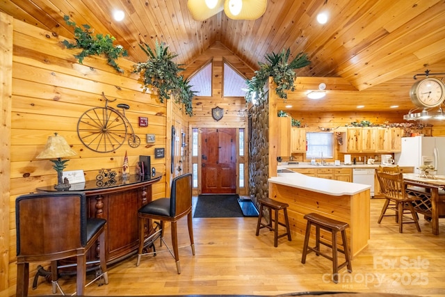 kitchen featuring wood ceiling, white appliances, sink, and light hardwood / wood-style flooring