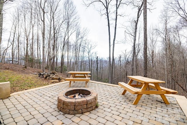 view of patio / terrace featuring a fire pit