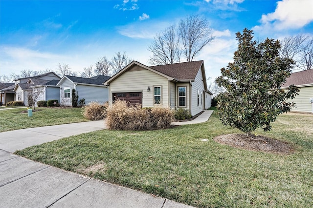 view of front of property featuring a garage and a front yard