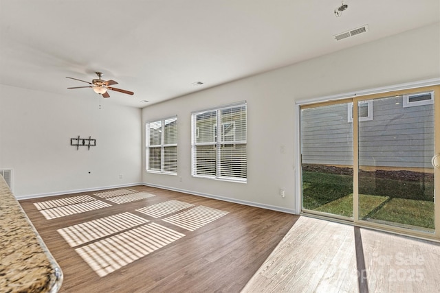 unfurnished room featuring wood-type flooring and ceiling fan