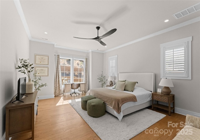 bedroom with visible vents, light wood-style flooring, recessed lighting, crown molding, and baseboards