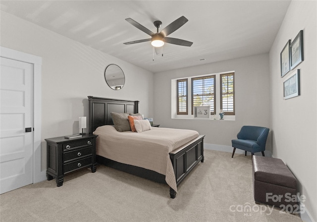 bedroom with light carpet, baseboards, and ceiling fan