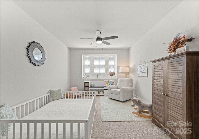 bedroom featuring baseboards, carpet floors, and ceiling fan