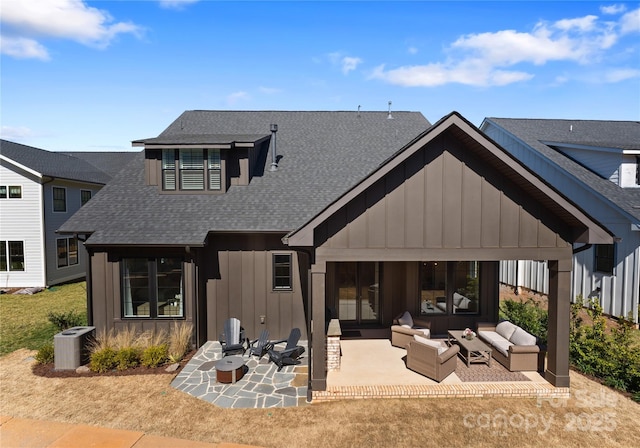 back of house with central air condition unit, board and batten siding, an outdoor hangout area, and a patio