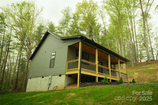 rear view of house with crawl space