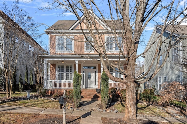 view of property with ceiling fan and covered porch