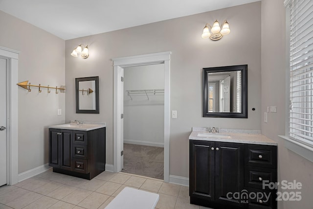 bathroom with tile patterned floors and vanity