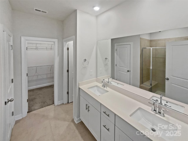 bathroom featuring vanity and walk in shower