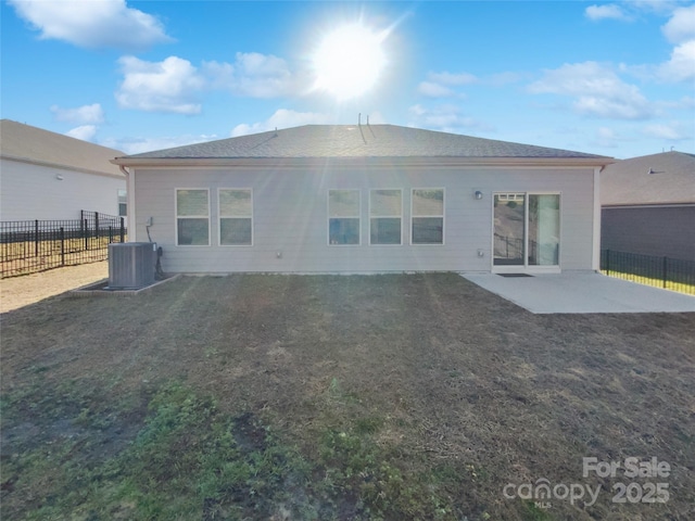 back of property with a patio and central air condition unit