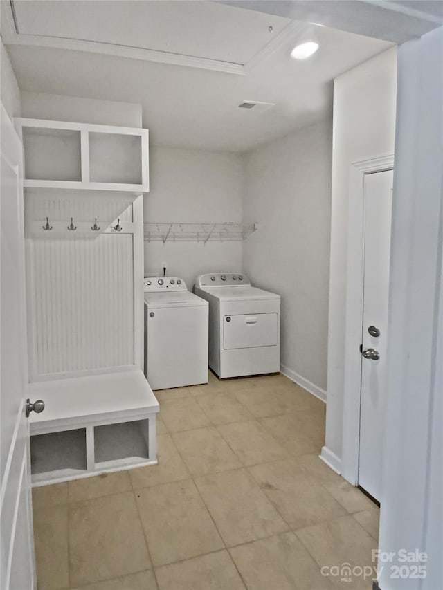 washroom with independent washer and dryer