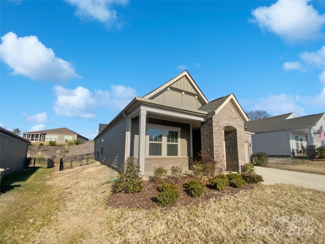 craftsman-style house with a front yard