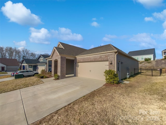 view of front of property with a garage and a front yard