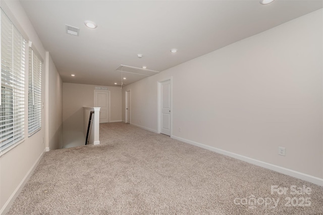 spare room with light colored carpet