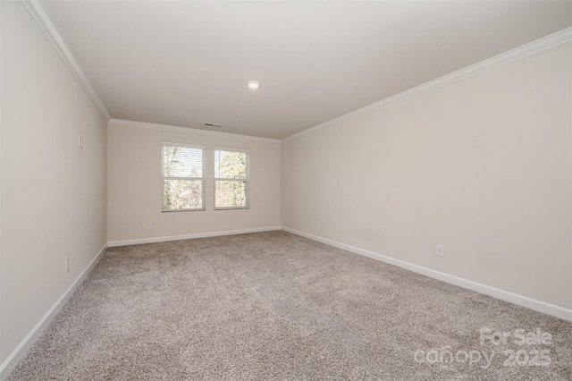 carpeted spare room with ornamental molding