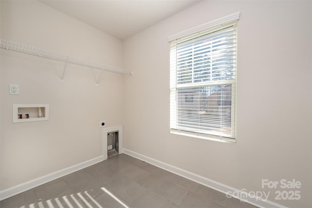 clothes washing area with hookup for an electric dryer, washer hookup, and tile patterned floors