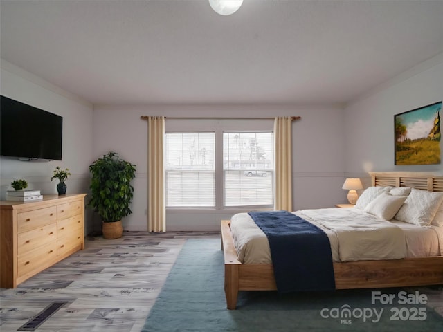 bedroom featuring crown molding