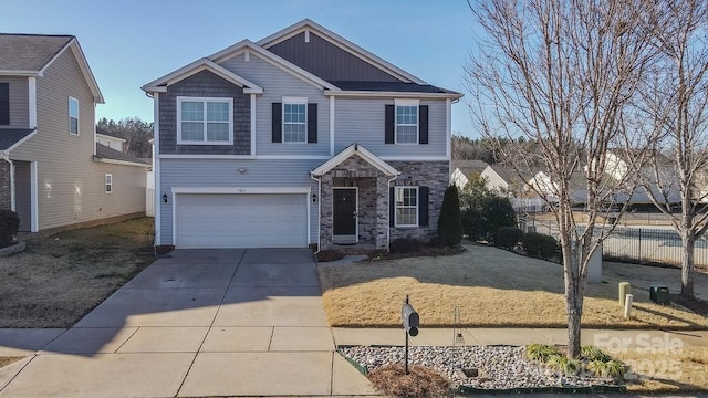 view of front facade with a garage and a front lawn