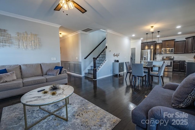 living room featuring ornamental molding, ceiling fan, and dark hardwood / wood-style flooring