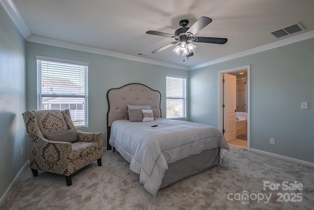 carpeted bedroom featuring ceiling fan, ornamental molding, and ensuite bathroom