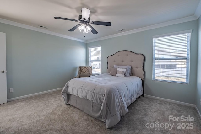 carpeted bedroom with crown molding and ceiling fan