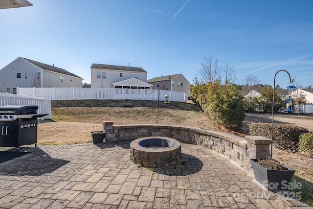 view of patio / terrace featuring area for grilling and an outdoor fire pit