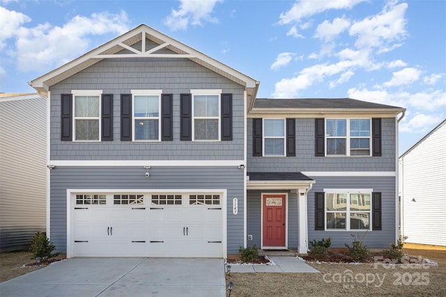 view of front of property with a garage