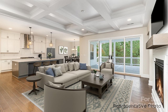 living room featuring coffered ceiling, beam ceiling, and dark hardwood / wood-style flooring