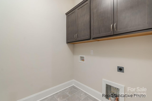 clothes washing area featuring cabinets, electric dryer hookup, and hookup for a washing machine