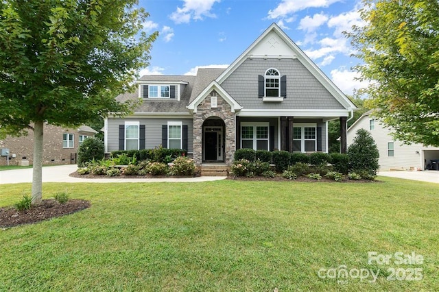 craftsman-style house with a front yard