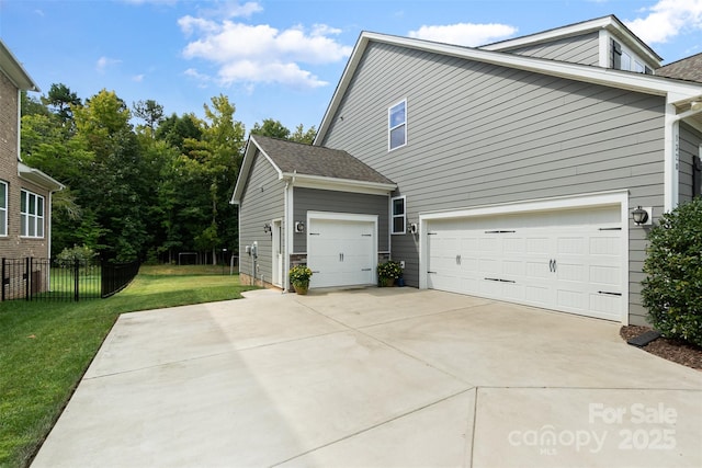 view of side of home with a yard