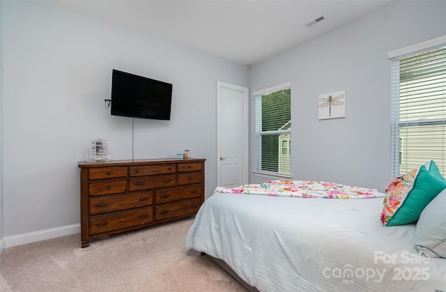 bedroom with light colored carpet