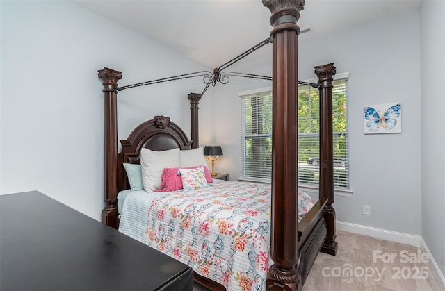 bedroom featuring light colored carpet